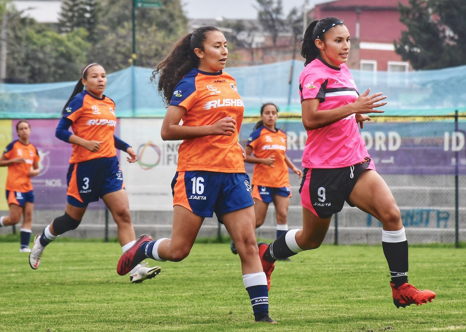 Women running on pitch